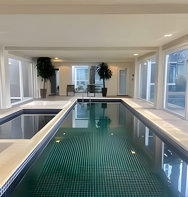 Charmoso Apto com piscina aquecida e lareira.