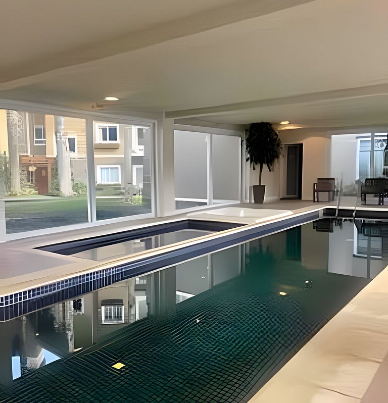 Charmoso Apto com piscina aquecida e lareira.